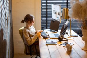 Woman works from cozy home office